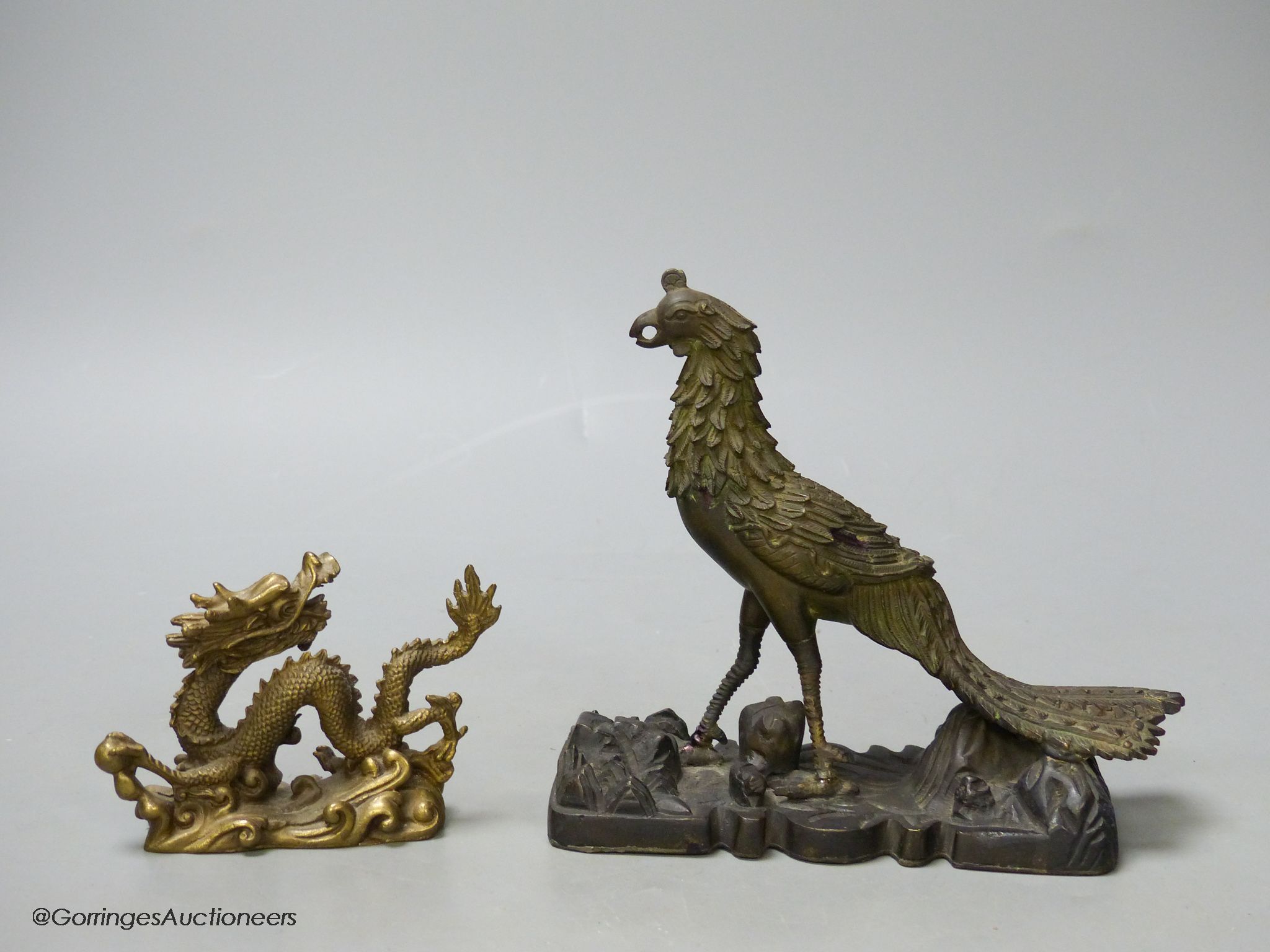 A 19th century Chinese bronze figure of a phoenix, repairs, and a 20th century Chinese bronze figure of a dragon, tallest 13.5cm